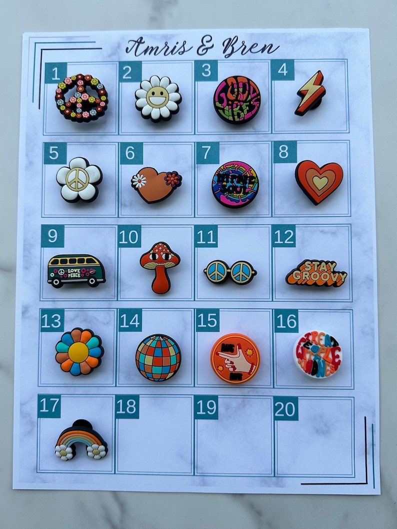May include: A chart displaying 20 colourful, round, plastic shoe charms with various designs, including peace signs, flowers, hearts, mushrooms, and a bus. The chart is labelled with numbers 1 through 20.