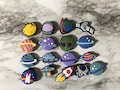 New popular outer space shoe charms for your crocs, planet shoe charms, croc compatible charms, clog charms, rocket ship, alien, spaceships product logo