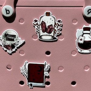 witch themed bogg compatible purse charms, potion charms for bogg bags, magic book charms that fit in baby bogg and original bogg bags