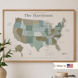 May include: A framed wall map of the United States featuring muted green, blue, and tan color-coded states. The text reads The Adventures of The Harrisons from 2020. It includes a legend for adventures and places to explore with a dotted line.