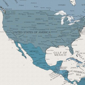 May include: A blue and white map of North America, showing the United States, Canada, Mexico, and Central America. The map includes major cities and states, as well as the Gulf of Mexico and the Caribbean Sea.