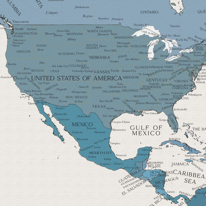 May include: A blue and white map of North America, showing the United States, Canada, Mexico, and Central America. The map includes major cities and states, as well as the Gulf of Mexico and the Caribbean Sea.