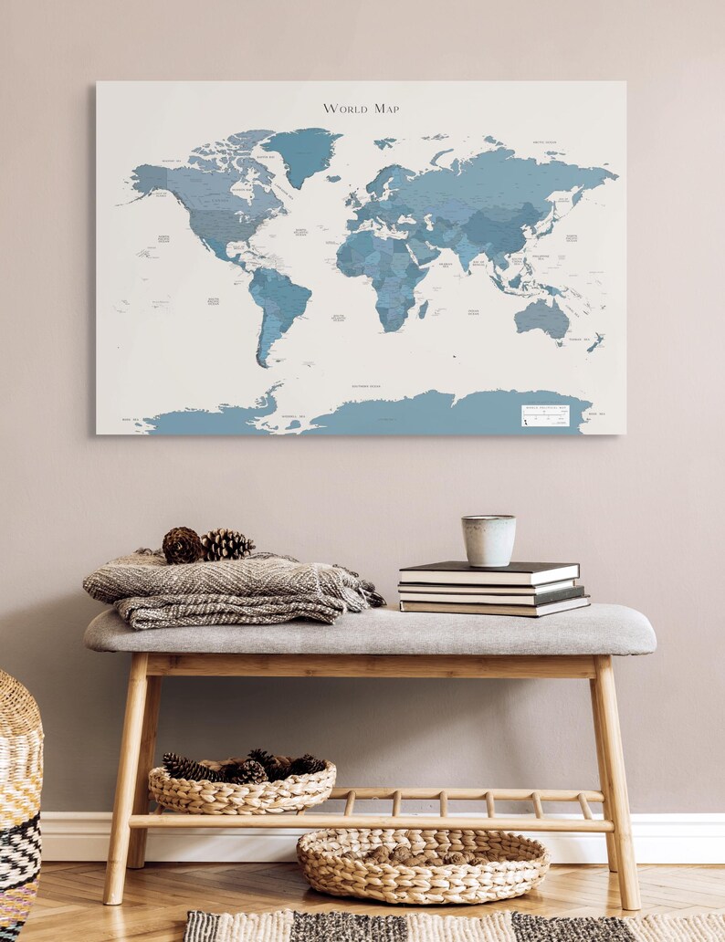 Close-up of a navy world map with minimalist design and soft wanderlust lettering; perfect for travel lovers who want a stylish and calming piece of wall decor.