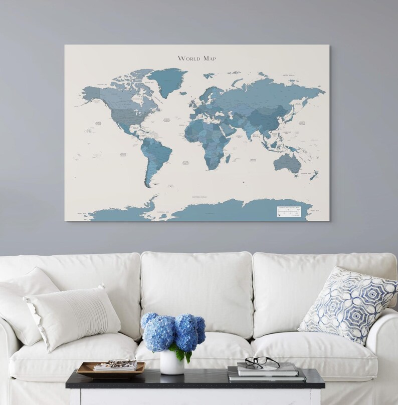 Navy and dark blue world map showing detailed continents and oceans, styled in a light and airy living room for a calming and coastal atmosphere.