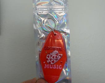 Country Music Hotel Keychain: Red Heart Hat Design