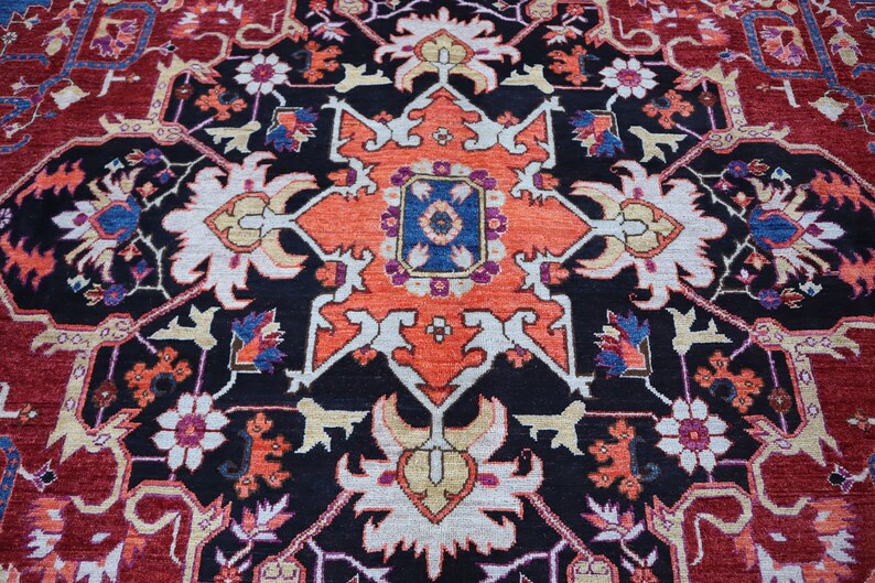 May include: A traditional Persian rug with a black background and intricate floral patterns in shades of red, orange, white, blue, and yellow.