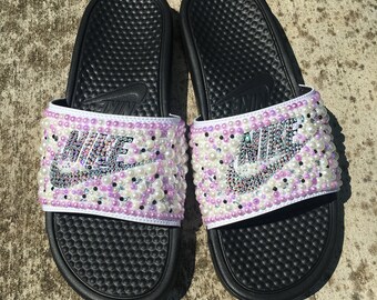 pink and purple nike slides