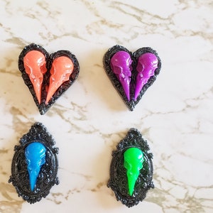 Raven Skulls On Crests With Filigree - Glow In The Dark - Magnets & Pins - Gothic