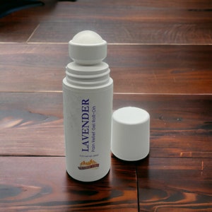 May include: White roll-on bottle with the text "LAVENDER Pain Relief Gel Roll-On". The bottle is open, with the cap next to it. The product is 3 oz (85g).