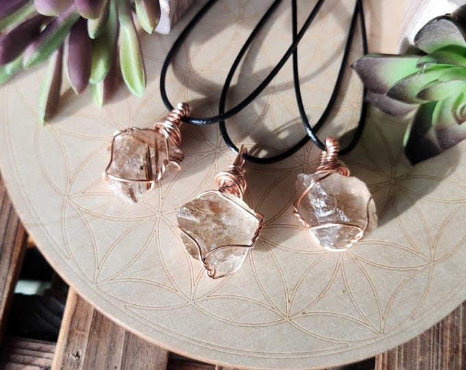 Golden Rutilated Quartz Wire Wrapped Gemstone Pendant with Copper Wire on Black Cord