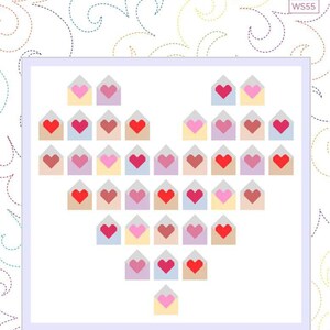 May include: A quilt with a heart design made of colorful envelopes, each with a heart. The quilt is labeled "Pen Pals" and measures 70" x 67-1/2". The background has a decorative swirl pattern.