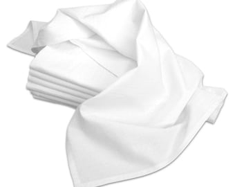 May include: A stack of folded white cloth napkins with a few unfolded napkins draped over them. The napkins are made of a smooth, likely linen or cotton material. The edges of the napkins have a subtle, finished hem.