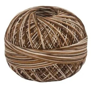 May include: A ball of brown and white yarn with a striped pattern.