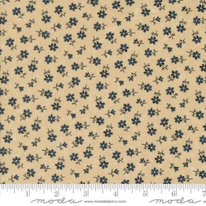 May include: A beige fabric with a repeating pattern of small blue flowers. The fabric is textured and has a subtle sheen.