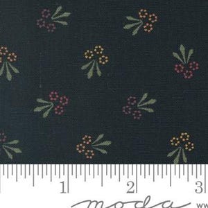 May include: A dark blue fabric with a repeating pattern of small, stylized floral sprigs in shades of orange, pink, and green.