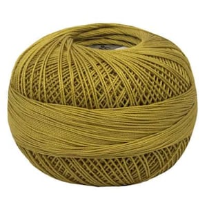 May include: A ball of golden yellow embroidery floss.