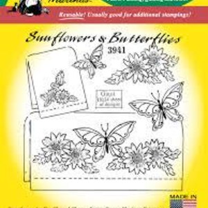 May include: Iron-on transfer sheet featuring a design of sunflowers and butterflies. The sheet includes the text "Sunflowers & Butterflies" and "Aunt Martha's". The design is intended for embroidery, fabric painting, quilting, and more.