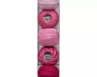 May include: Five balls of pink and purple yarn in a clear plastic packaging. The yarn is arranged in a gradient from light purple to dark pink. The packaging has the word "Lizbeth" printed on it.