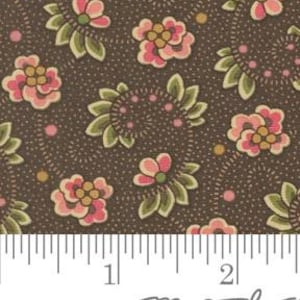 May include: A brown fabric with a repeating pattern of pink and yellow flowers with green leaves. The background has a subtle brown speckled pattern.