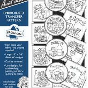 May include: Aunt Martha's embroidery transfer pattern featuring wine-themed designs. The pattern includes various circular and rectangular designs with images of wine bottles, glasses, and grapes. The sheet measures 18 x 24 inches and is iron-on.