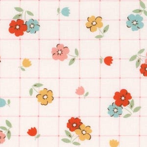 May include: White fabric featuring a grid pattern adorned with colourful floral designs. The flowers are red, yellow, pink, and blue, with green leaves. The grid lines are a soft pink.