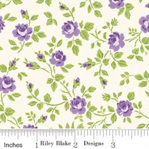 May include: Cream-colored fabric with a floral pattern featuring purple roses and green leaves. The design includes stems and buds. The fabric is measured in inches, with the Riley Blake Designs logo visible.