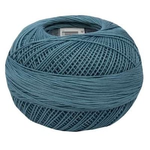 May include: A ball of teal blue yarn.