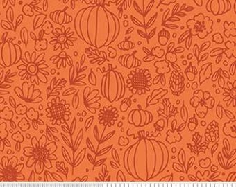 Puede incluir: Tela naranja con un patrón repetido de calabazas, flores, hojas y bellotas en un contorno naranja más oscuro. La tela se mide con una regla en pulgadas.