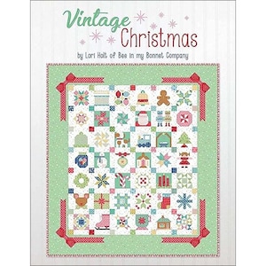 May include: Vintage Christmas quilt pattern featuring a green background with a variety of colorful Christmas-themed blocks. The pattern is titled "Vintage Christmas" by Lori Holt of Bee in My Bonnet Company.