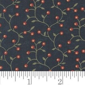 May include: Dark navy fabric with a repeating pattern of red berries and green vines. The fabric is marked with a ruler showing inches. The word "moda" is written in cursive at the bottom.