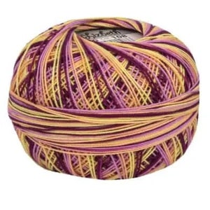 May include: A ball of multi-colored embroidery floss in shades of purple, yellow, and orange. The floss is wound around a white label that reads "Elizabeth 108".