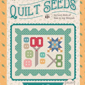 May include: A quilt pattern design with the text "QUILT SEEDS" and "Scissors & Buttons". The design features a central quilt block with scissors, buttons, and a star. The background is a floral pattern.
