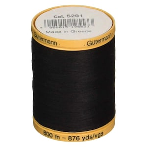 May include: A black Gutermann thread spool with yellow accents. The top and bottom are yellow, with text including "Col. 5201" and "Made in Greece". Contains 800 m of thread, equivalent to 876 yds.