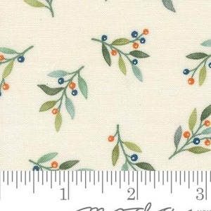 May include: Cream-colored fabric with a repeating pattern of stylized green and blue leaves and orange berries. The fabric has a ruler along the bottom edge, with the "moda" logo in the lower center.