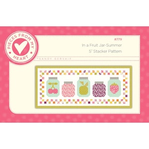 May include: A colorful quilt pattern titled "In a Fruit Jar-Summer 5" Stacker Pattern." The design features five fruit jars, each filled with a different fruit: cherries, flowers, pineapple, berries, and a strawberry. The background is a light cream color with a pink border.