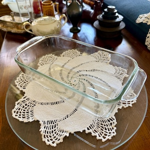 May include: A rustic wooden sign with the text "Welcome to our home" in white lettering. The sign has a distressed finish and a simple, inviting design, ideal for entryway decor.