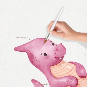 May include: Hand-painted watercolor illustration of a pink dragon with a striped belly. The dragon is smiling and has a friendly expression. The illustration is labeled "Hand Painted" in the top left corner.