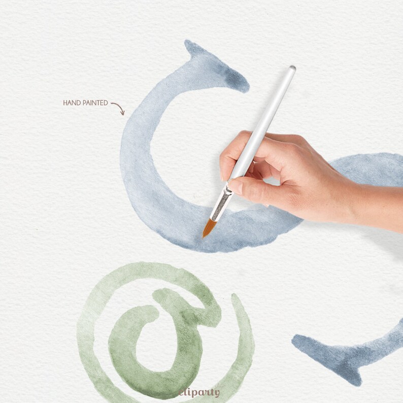 May include: Hand painted watercolour illustration of an at symbol. The illustration is in shades of green and blue. The image shows a hand holding a paintbrush over the illustration.