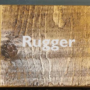 May include: Three wood samples showing different wood stains: English Oak, a light brown stain;  Rugger, a medium brown stain; and Jacobean, a dark brown stain.