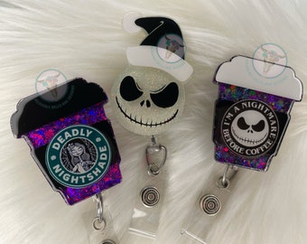 May include: Three Halloween-themed  glitter-filled badge holders. One features a coffee cup with the text "Deadly Nightshade" and a cartoon character. Another features a coffee cup with the text "I'm a Nightmare Before Coffee" and a cartoon character. The third features a cartoon character with a Santa hat.