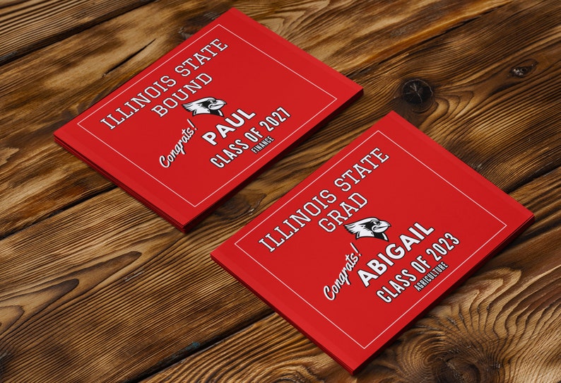 May include: Two red graduation announcements with white text. The top announcement says "Illinois State Bound" and "Congrats! Paul Class of 2027 Finance". The bottom announcement says "Illinois State Grad" and "Congrats! Abigail Class of 2023 Agriculture".