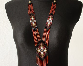 Handmade jewelry. Long seed bead necklace. Red, black, white and gold tones.