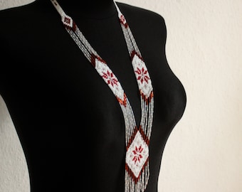 Handmade jewelry. Long seed bead necklace. White, red and silver tones.