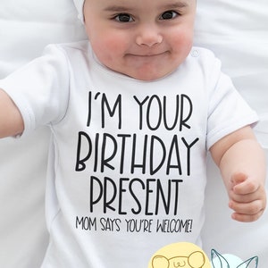 I'm Your Birthday Present Baby Bodysuit | Funny Dad Birthday Husband Baby Gift |  Mom Says You're Welcome - Baby Shirt for Father's Birthday