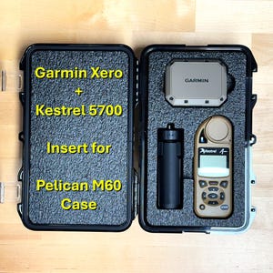 May include: A black Pelican M60 case with a custom insert for a Garmin Xero and a Kestrel 5700. The case is open and the insert is visible. The Garmin Xero and Kestrel 5700 are not included.
