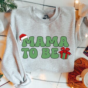 Bluza z kapturem Mama to be Christmas, Bluza z ogłoszeniem ciąży na Boże Narodzenie, Prezent dla mamy to be, Bluza z okrągłym dekoltem w ciąży na Boże Narodzenie, Bluza z kapturem dla oczekujących