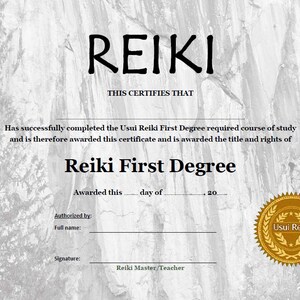 May include: A certificate with a gray background and a gold seal. The certificate reads "REIKI" in large letters at the top and "This certifies that" below. The text continues, "Has successfully completed the Usui Reiki First Degree required course of study and is therefore awarded this certificate and is awarded the title and rights of Reiki First Degree." The certificate is signed "Reiki Master/Teacher" and the seal reads "Usui Reiki".