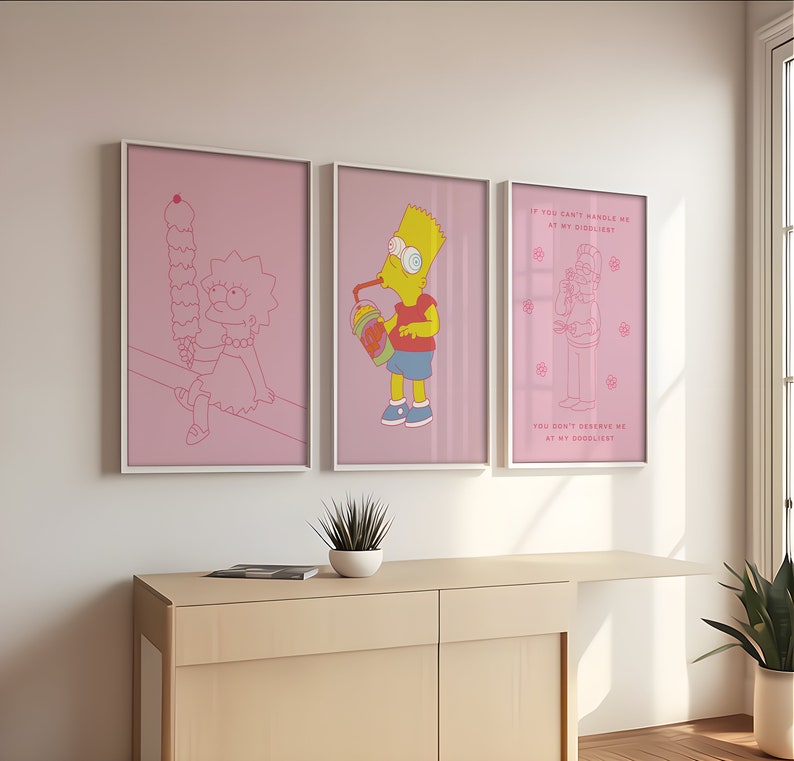 May include: Three pink framed illustrations of characters from the Simpsons cartoon. The first illustration shows Lisa Simpson sitting and eating a large ice cream cone. The second illustration shows Bart Simpson drinking a large beverage. The third illustration shows Homer Simpson with a thought bubble above his head that says "If you can't handle me at my didiliest, you don't deserve me at my doooliest."