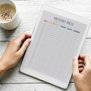May include: A white tablet with a monthly bills checklist. The checklist includes columns for paid, month, bill, due date, amount, and notes. There are checkboxes next to each line.