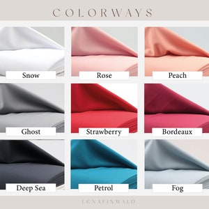 May include: Nine fabric swatches in different colors, including Snow, Rose, Peach, Ghost, Strawberry, Bordeaux, Deep Sea, Petrol, and Fog.